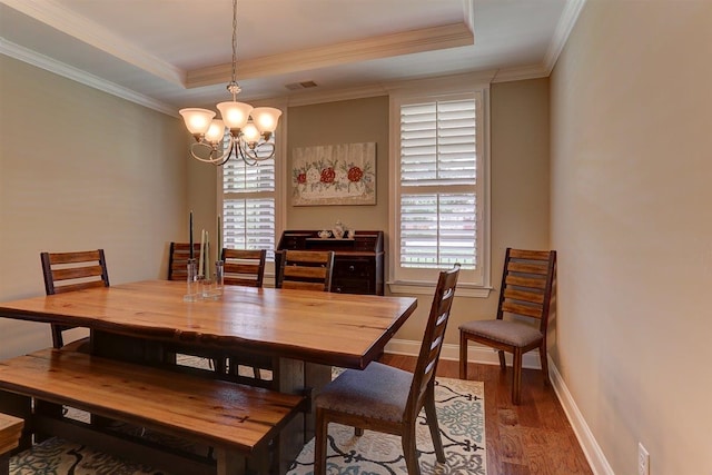 280 Cotton Trail Dr, Rossville, TN 38066 - dining area featuring a chandelier, a tray ceiling, wood finished floors, healthy amount of natural light, and crown molding