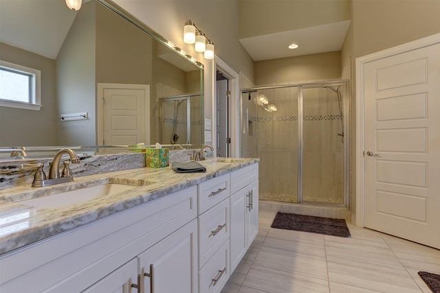 280 Cotton Trail Dr, Rossville, TN 38066 - bathroom featuring double vanity, a shower stall, tile patterned floors, and vaulted ceiling