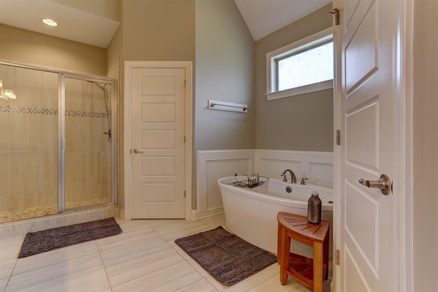280 Cotton Trail Dr, Rossville, TN 38066 - full bath with a freestanding tub, a shower stall, lofted ceiling, tile patterned floors, and a decorative wall