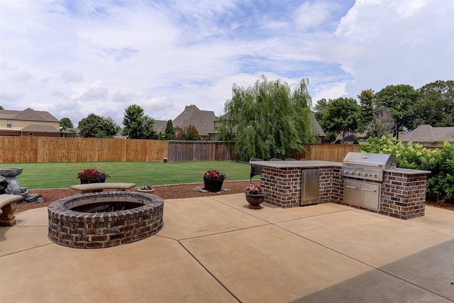 280 Cotton Trail Dr, Rossville, TN 38066 - fenced backyard with area for grilling, a patio, and an outdoor fire pit