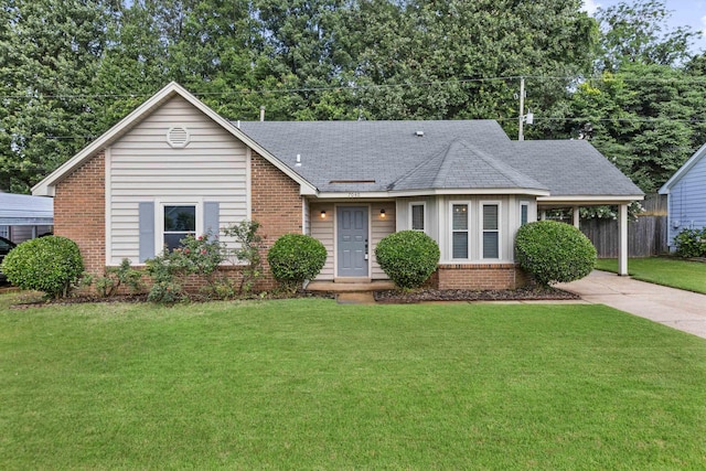 7040 Daneman Dr, Memphis, TN 38133 - ranch-style house with brick siding, concrete driveway, a carport, and a shingled roof