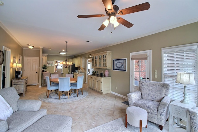 774 Wellington Way Cv, Collierville, TN 38017 - living room featuring crown molding, a chandelier, light tile patterned floors, and ceiling fan
