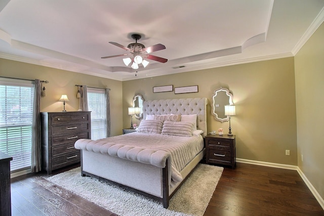 774 Wellington Way Cv, Collierville, TN 38017 - bedroom featuring a tray ceiling, dark wood-type flooring, a ceiling fan, and crown molding