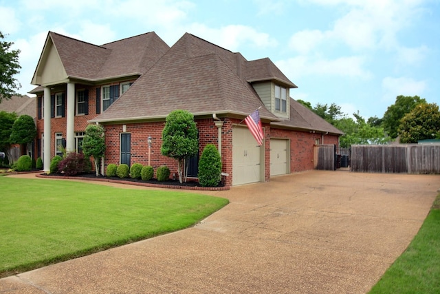 774 Wellington Way Cv, Collierville, TN 38017 - view of front of property featuring brick siding, driveway, roof with shingles, and a garage