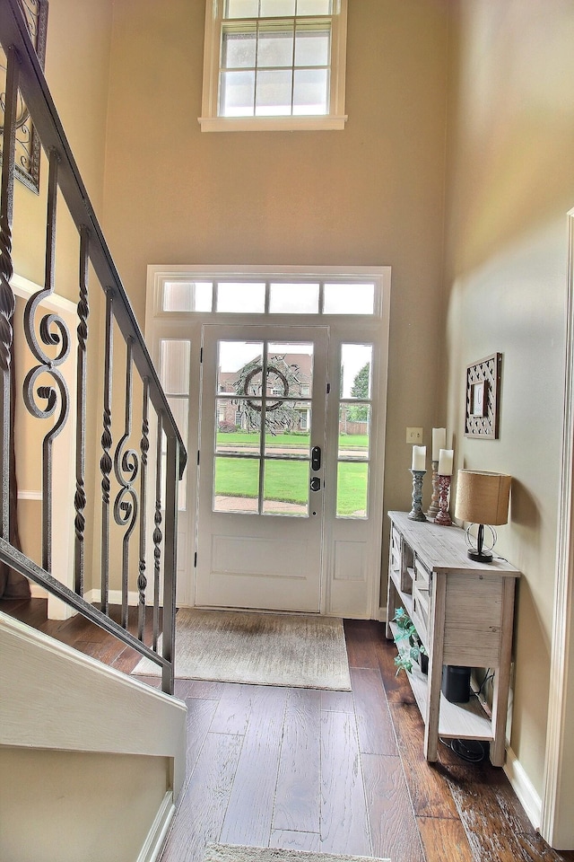 774 Wellington Way Cv, Collierville, TN 38017 - foyer with a high ceiling, wood-type flooring, and stairway