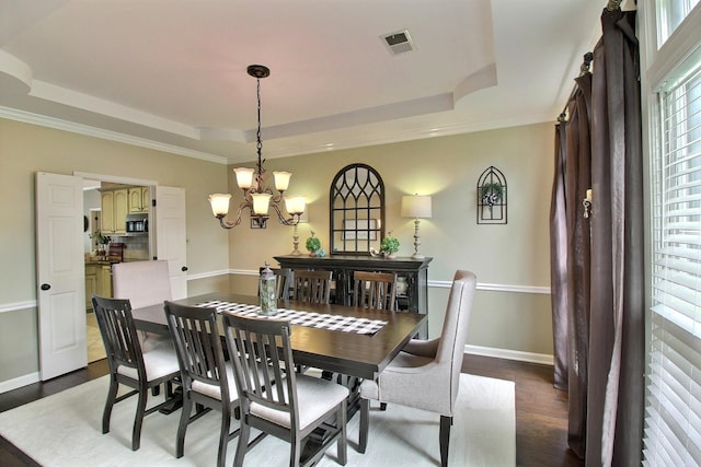 774 Wellington Way Cv, Collierville, TN 38017 - dining area featuring a tray ceiling, a chandelier, and dark wood finished floors