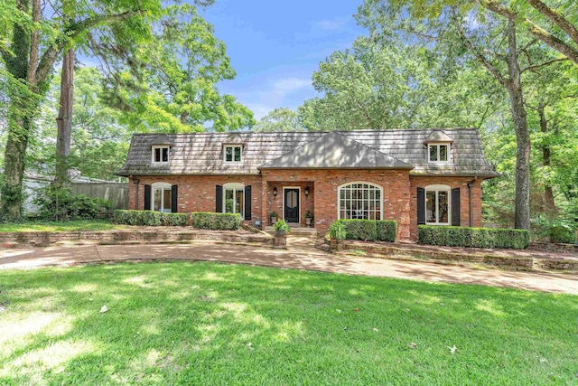 2004 Kirby Rd, Memphis, TN 38119 - front of property featuring brick siding, a front yard, and mansard roof