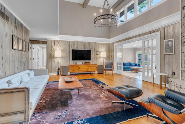 2004 Kirby Rd, Memphis, TN 38119 - living area with a chandelier, a high ceiling, plenty of natural light, wood finished floors, and french doors