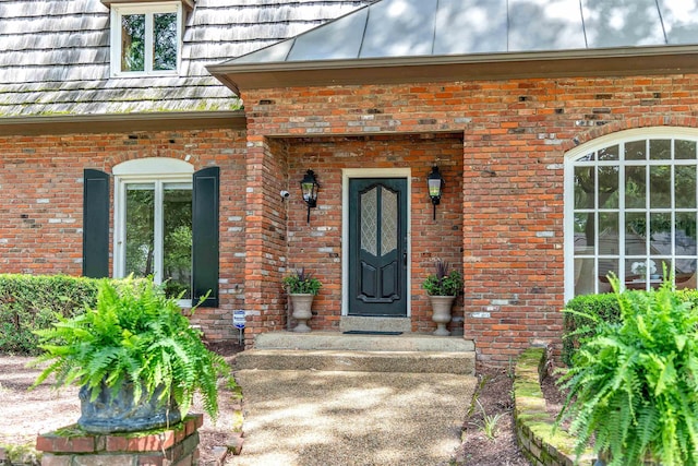 2004 Kirby Rd, Memphis, TN 38119 - doorway to property featuring brick siding and a standing seam roof