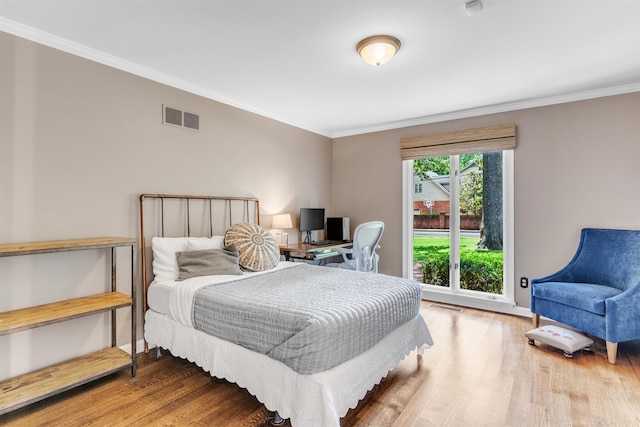 2004 Kirby Rd, Memphis, TN 38119 - bedroom featuring wood finished floors, crown molding, and an office area