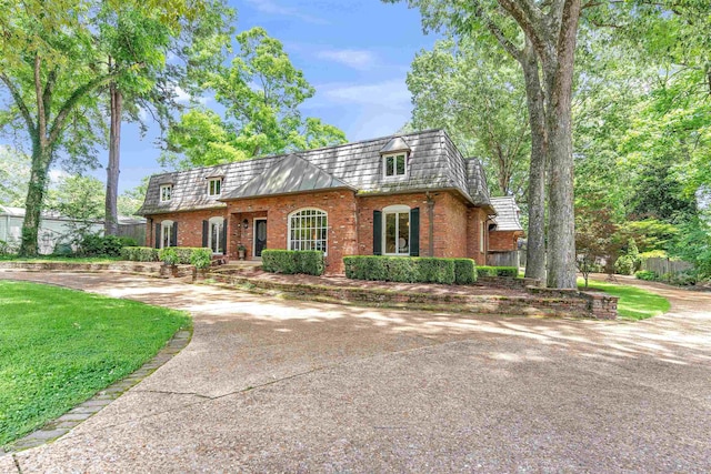 2004 Kirby Rd, Memphis, TN 38119 - view of property with mansard roof, brick siding, and concrete driveway