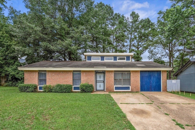 3476 Meier Dr, Memphis, TN 38118 - view of front of house with brick siding, a front lawn, and concrete driveway