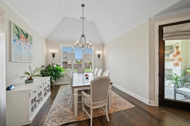 4741 Carousel Ln, Collierville, TN 38017 - dining room featuring dark wood-type flooring, a chandelier, vaulted ceiling, and ornamental molding