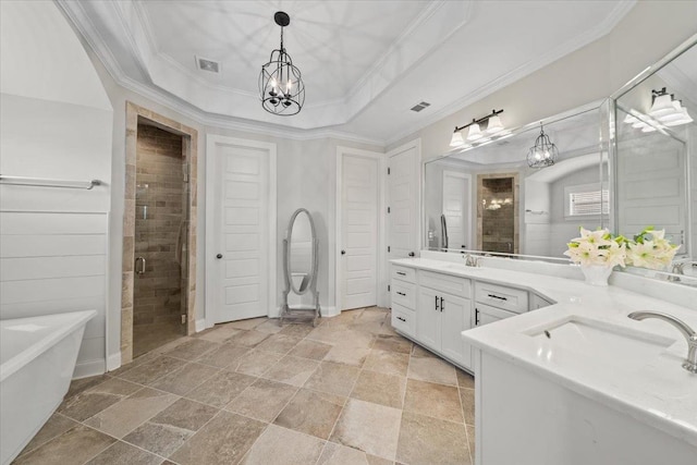 4741 Carousel Ln, Collierville, TN 38017 - full bath with two vanities, a freestanding bath, stone tile flooring, crown molding, and a shower stall