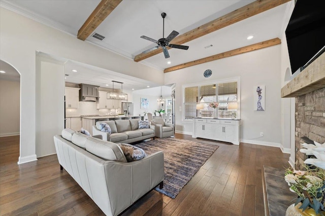 4741 Carousel Ln, Collierville, TN 38017 - living area with ceiling fan, arched walkways, beamed ceiling, dark wood-style floors, and recessed lighting