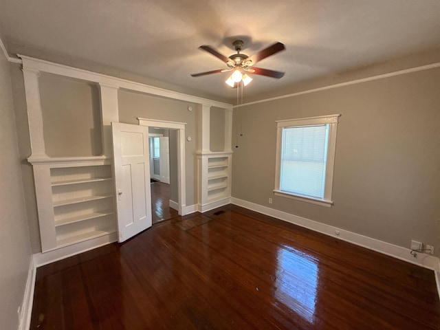 1053 Fleece Pl, Memphis, TN 38104 - unfurnished bedroom featuring dark wood-style flooring and a ceiling fan