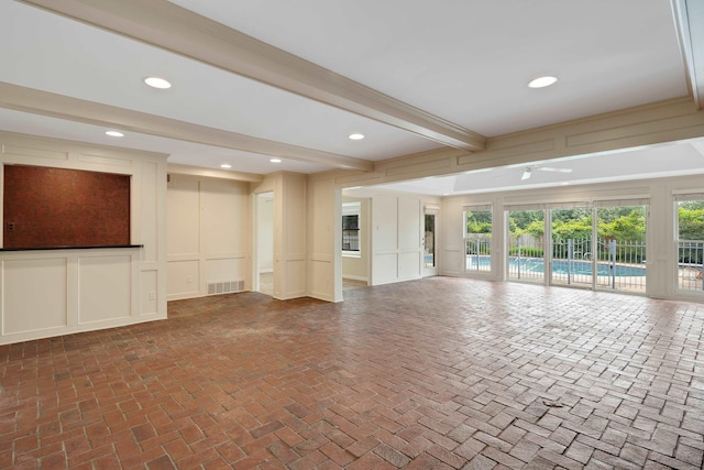 460 Jason Dr, Memphis, TN 38120 - unfurnished living room featuring ceiling fan, a decorative wall, beamed ceiling, brick flooring, and recessed lighting