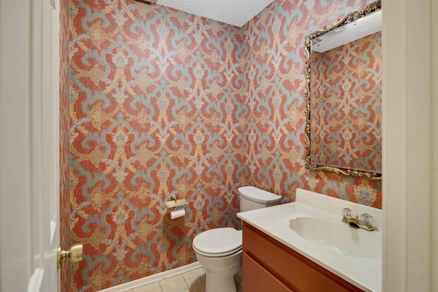 460 Jason Dr, Memphis, TN 38120 - bathroom with wallpapered walls, a textured ceiling, vanity, and tile patterned floors