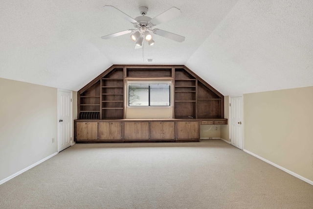 460 Jason Dr, Memphis, TN 38120 - bonus room with built in features, lofted ceiling, a textured ceiling, light colored carpet, and a ceiling fan