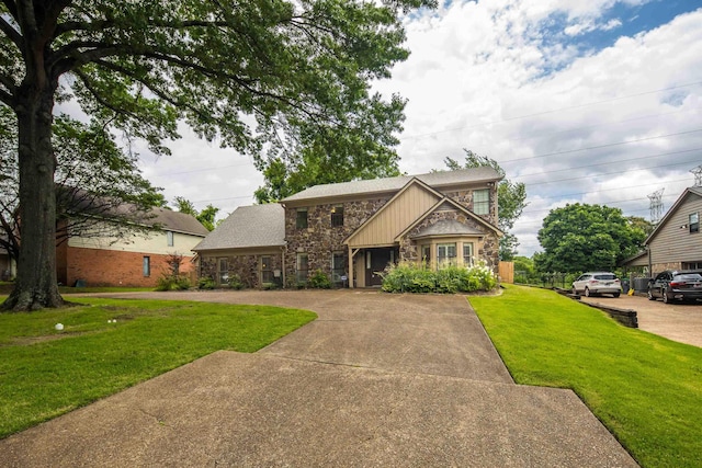 460 Jason Dr, Memphis, TN 38120 - craftsman house with stone siding and a front lawn