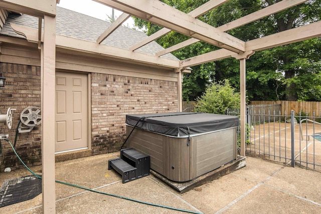 460 Jason Dr, Memphis, TN 38120 - view of patio / terrace featuring a hot tub and a pergola