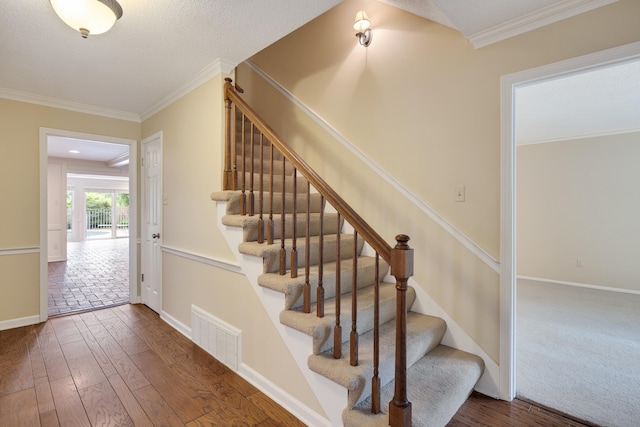 460 Jason Dr, Memphis, TN 38120 - stairs featuring wood finished floors and crown molding