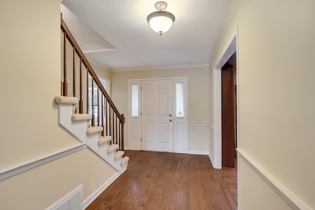 460 Jason Dr, Memphis, TN 38120 - entryway featuring wood finished floors, stairway, a textured ceiling, and crown molding