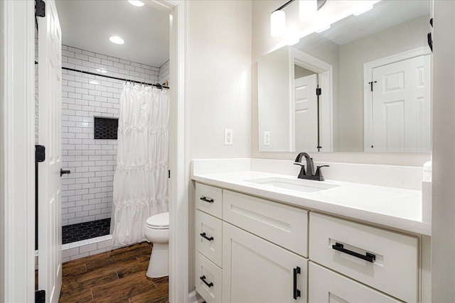 2165 Latting Hills Cv, Eads, TN 38016 - full bath with vanity, a tile shower, wood finished floors, and recessed lighting