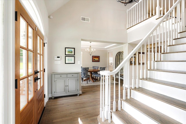 2165 Latting Hills Cv, Eads, TN 38016 - foyer featuring a chandelier, high vaulted ceiling, stairs, wood finished floors, and french doors