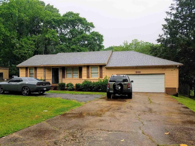 500 Sullivan Dr, Memphis, TN 38109 - single story home with driveway, a front yard, and a garage