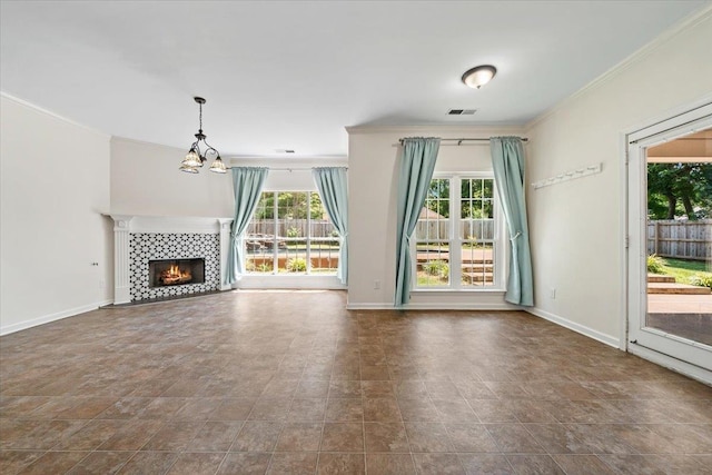 3760 Broadway Rd, Bartlett, TN 38135 - unfurnished living room featuring ornamental molding, a chandelier, stone finish flooring, and a fireplace