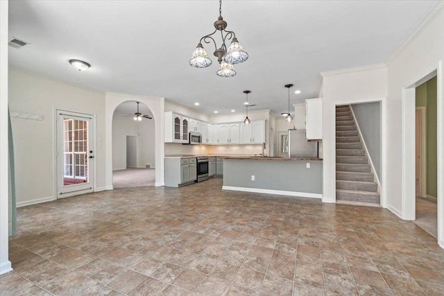3760 Broadway Rd, Bartlett, TN 38135 - unfurnished living room featuring a chandelier, stone finish floors, stairs, ceiling fan, and recessed lighting