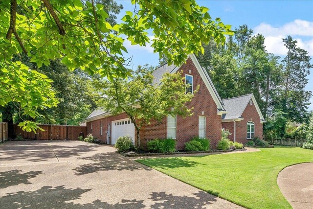 3760 Broadway Rd, Bartlett, TN 38135 - view of front facade featuring brick siding, a garage, and driveway