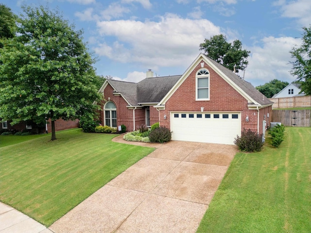 3964 Tonya Marie Ln, Bartlett, TN 38135 - traditional-style home with brick siding, driveway, a chimney, a garage, and roof with shingles