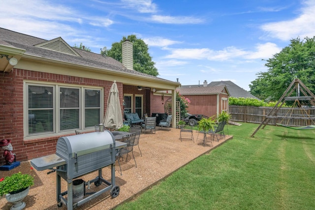 3964 Tonya Marie Ln, Bartlett, TN 38135 - view of yard featuring a patio, a storage shed, and a playground