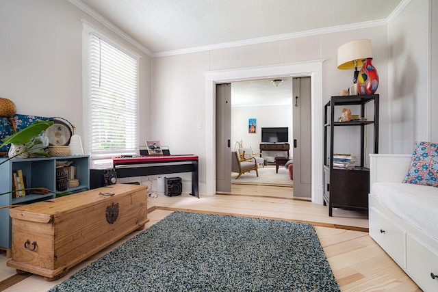 569 Lundee Pl, Memphis, TN 38111 - sitting room featuring wood finished floors, plenty of natural light, and ornamental molding