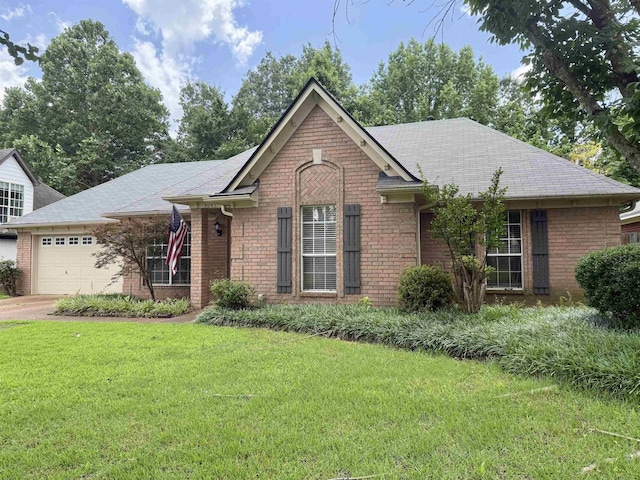 3043 Shadow Green Ln, Lakeland, TN 38002 - single story home with a garage, brick siding, a front lawn, and driveway