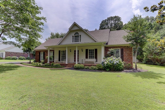 3365 Harrell Rd, Tn, TN 38002 - view of front of house featuring brick siding, a front lawn, a porch, and a shingled roof