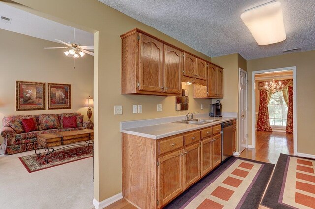 3365 Harrell Rd, Tn, TN 38002 - kitchen with dishwasher, light countertops, ceiling fan, a textured ceiling, and a chandelier