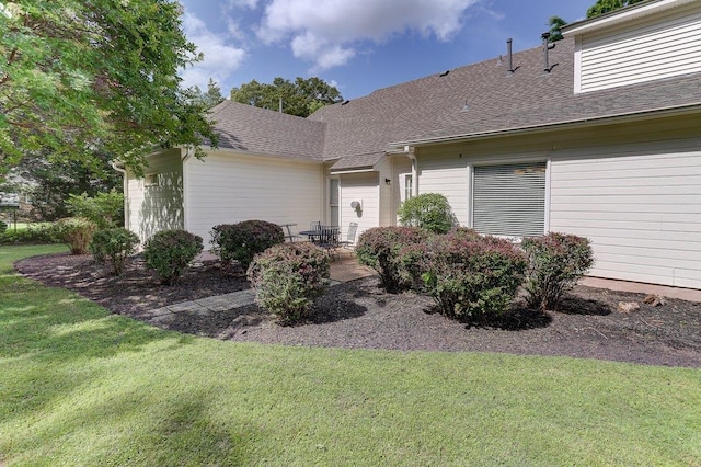 3365 Harrell Rd, Tn, TN 38002 - view of front facade with a front lawn, a shingled roof, and a patio
