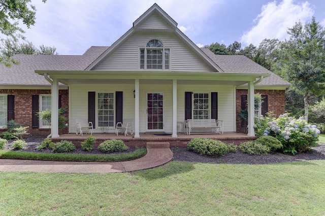 3365 Harrell Rd, Tn, TN 38002 - view of front of home with a porch, a front lawn, and brick siding