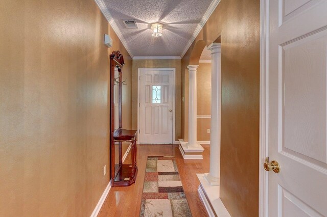 3365 Harrell Rd, Tn, TN 38002 - doorway with ornate columns, wood finished floors, ornamental molding, and a textured ceiling