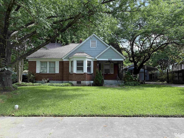 2776 Iroquois Rd, Memphis, TN 38111 - view of front of home with a porch, brick siding, a carport, a ceiling fan, and a shingled roof