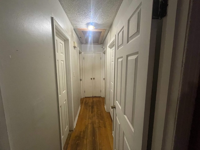 5128 Jessie Lee Ln, Memphis, TN 38118 - corridor featuring a textured ceiling, wood finished floors, and attic access