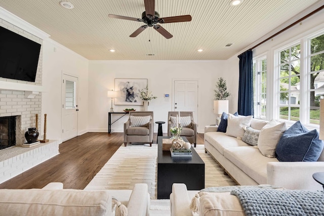 3846 Mimosa Ave, Memphis, TN 38111 - living area with ceiling fan, recessed lighting, a fireplace, wood finished floors, and ornamental molding