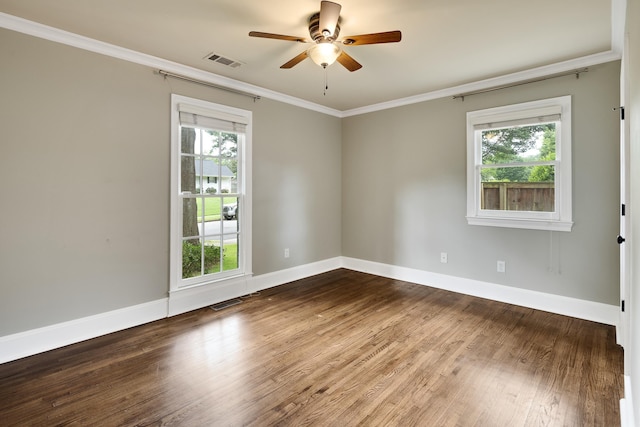 3846 Mimosa Ave, Memphis, TN 38111 - empty room featuring crown molding, plenty of natural light, ceiling fan, and wood finished floors