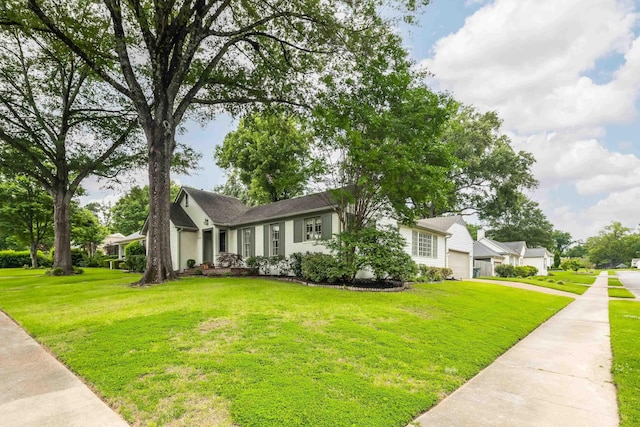 3846 Mimosa Ave, Memphis, TN 38111 - view of front facade with a front lawn, concrete driveway, and a garage