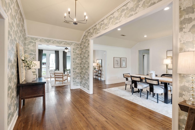 3846 Mimosa Ave, Memphis, TN 38111 - dining space with ornamental molding, wallpapered walls, lofted ceiling, dark wood-style floors, and a chandelier