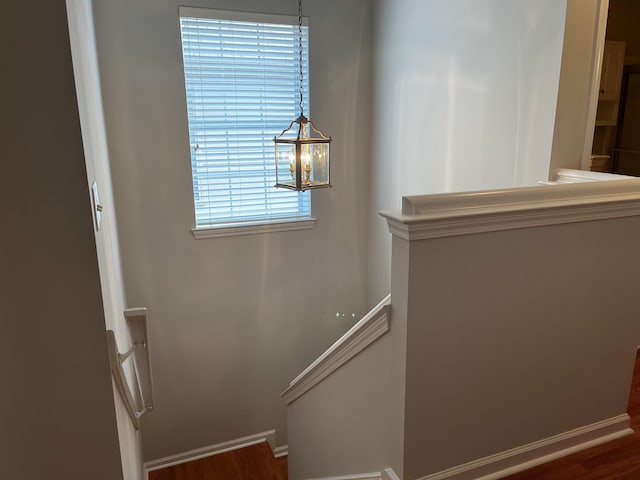 1182 Collierville-Arlington Rd, Collierville, TN 38017 - stairs featuring wood finished floors and a chandelier