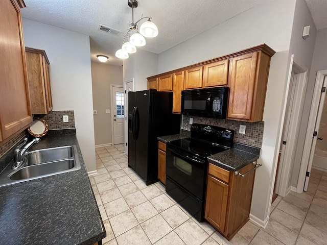 1182 Collierville-Arlington Rd, Collierville, TN 38017 - kitchen featuring black appliances, light tile patterned floors, tasteful backsplash, and a textured ceiling